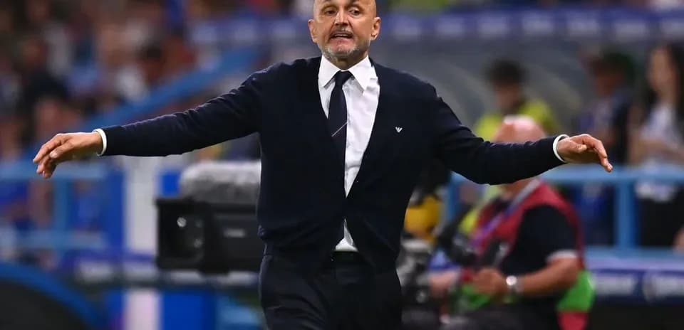 Coach gesturing on the sideline during match