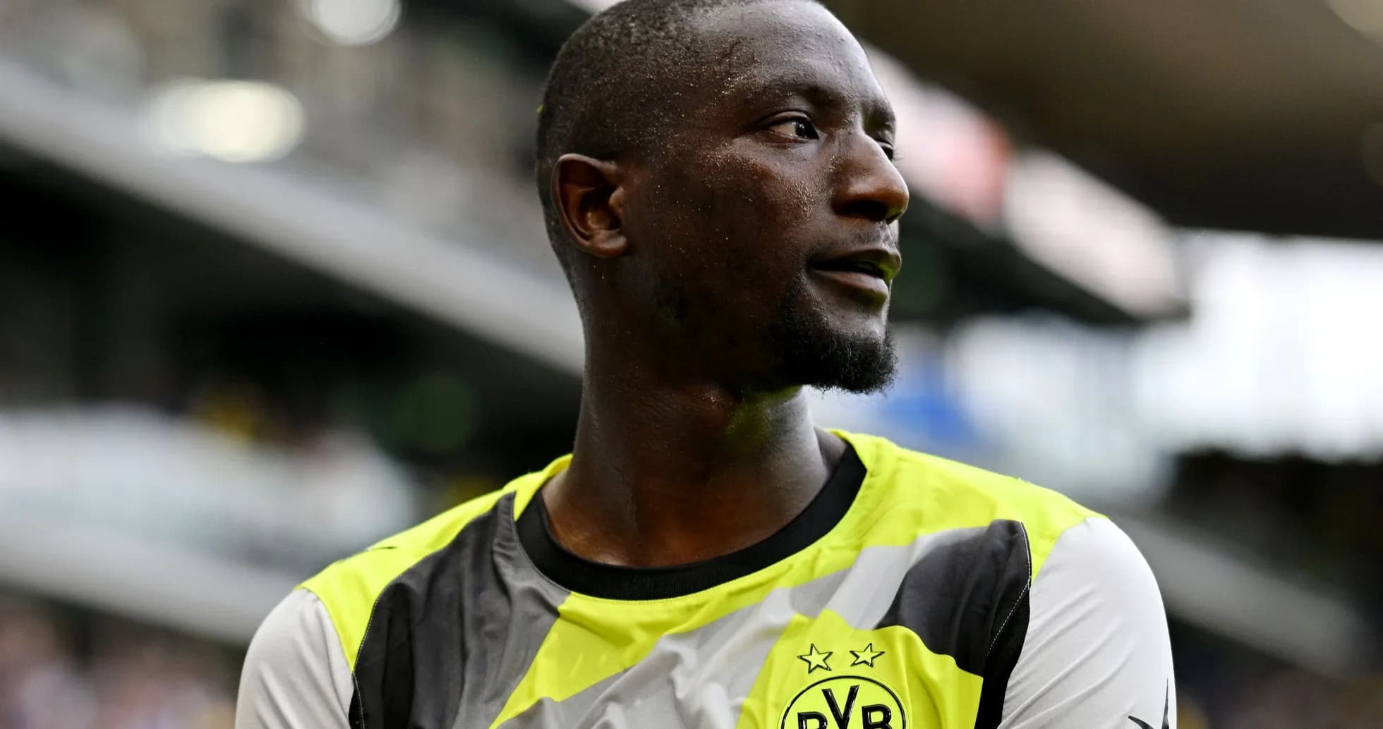 Player wearing Borussia Dortmund kit on the field