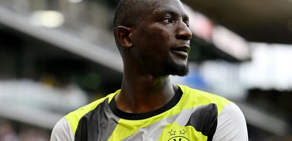 Player wearing Borussia Dortmund kit on the field
