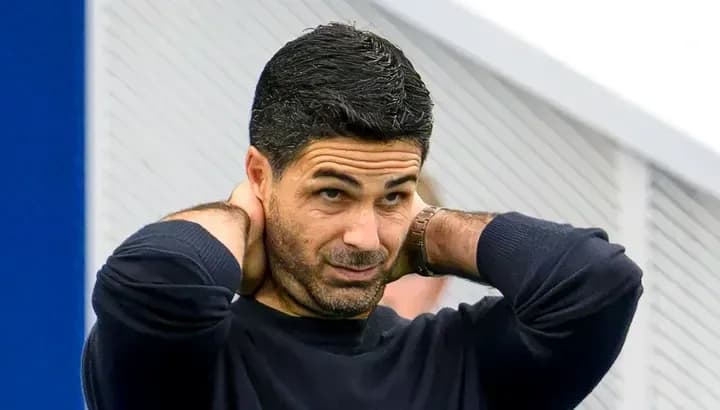 Coach adjusting his collar during training session