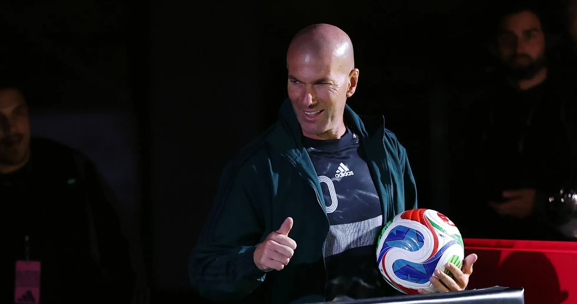 Zinedine Zidane giving a thumbs up with soccer ball