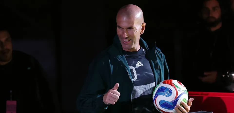 Zinedine Zidane giving a thumbs up with soccer ball