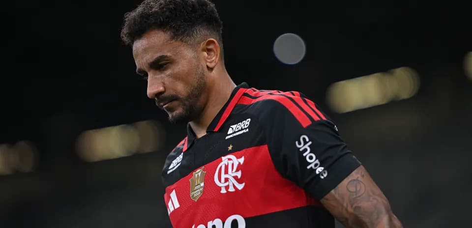 Player in Flamengo jersey walking off the field