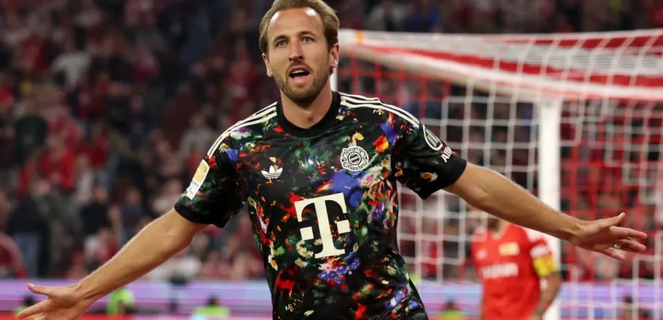 Player celebrating a goal in colorful jersey
