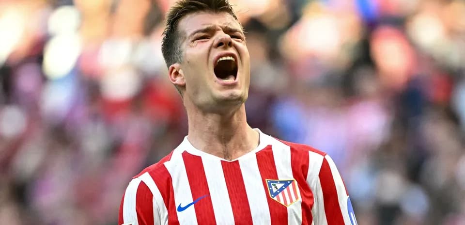 Atletico Madrid player celebrating passionately on field