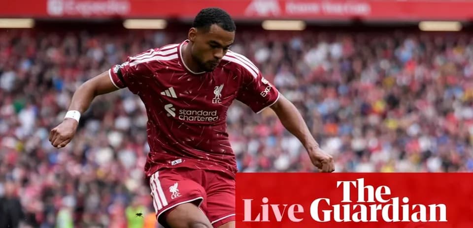 Liverpool player dribbling during match at Anfield