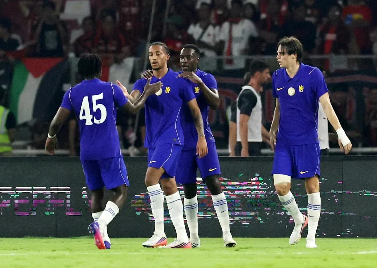 Players celebrating a goal on the field