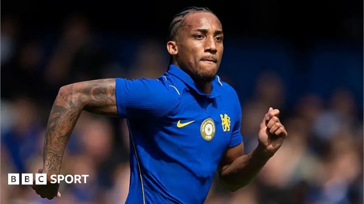 Player running in blue Chelsea kit during match