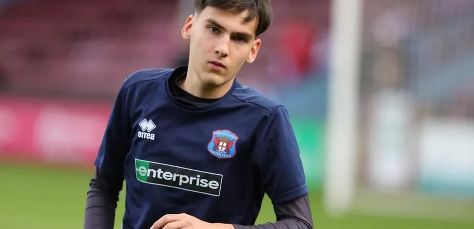 Young player warming up on the pitch