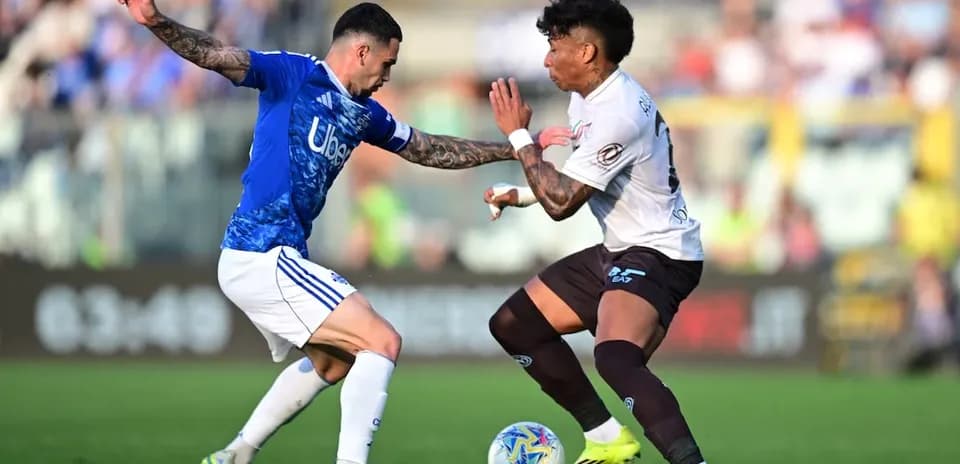 Two players challenging for the ball during match