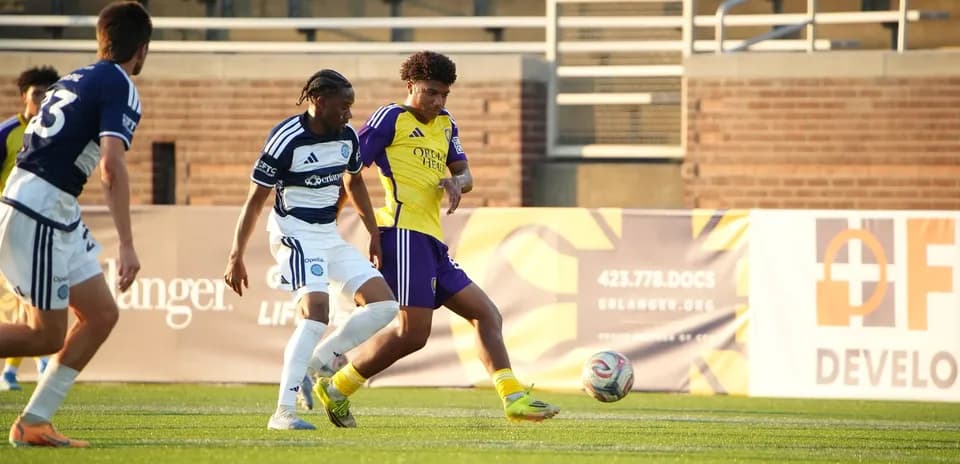 Players competing for the ball during match