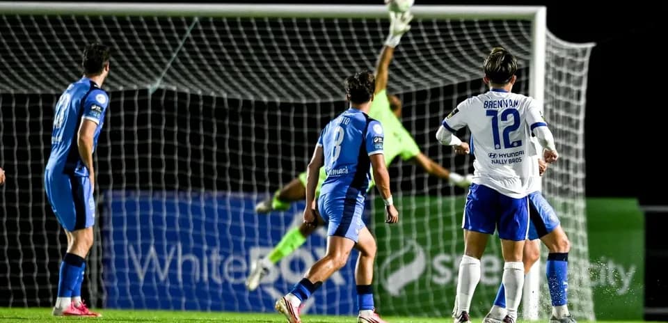 Goalkeeper making a save during football match