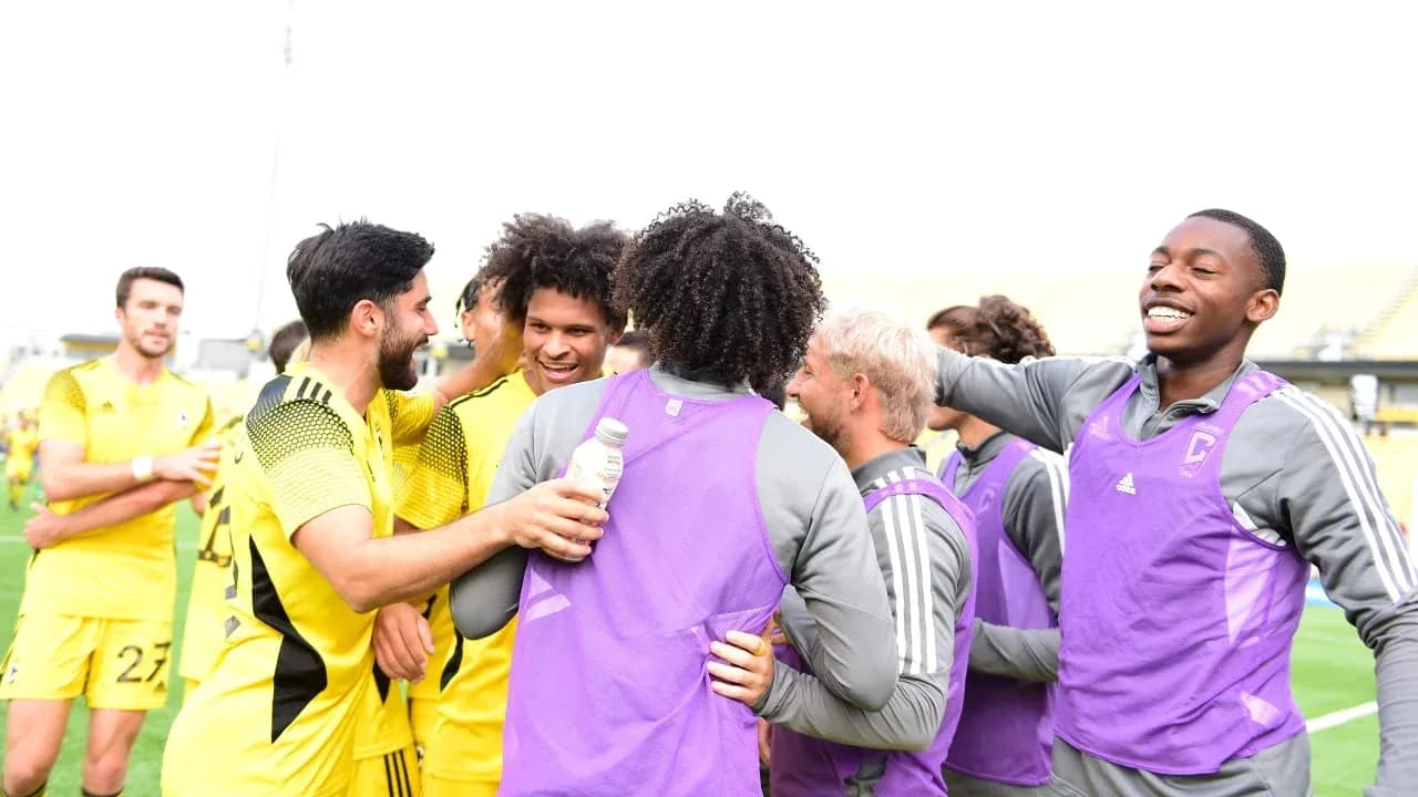 Players celebrating after a match at the stadium