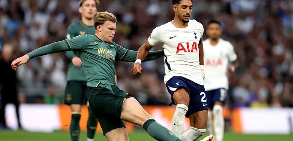 Player from Tottenham evading tackle during match