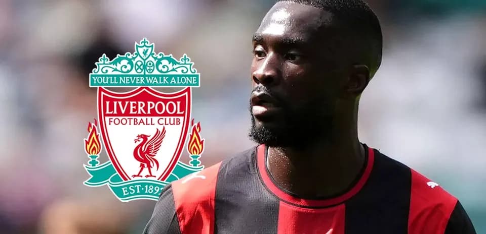 Player in black and red kit with Liverpool logo