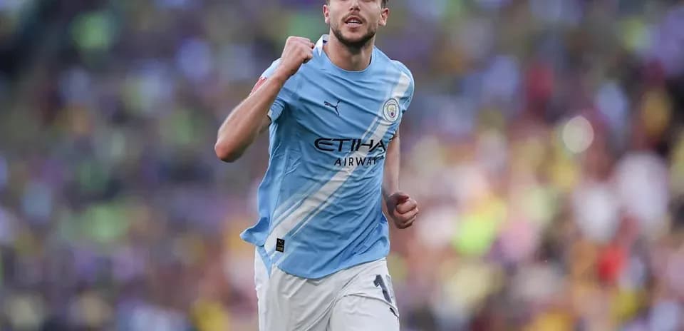 Player celebrating after scoring a goal for Manchester City