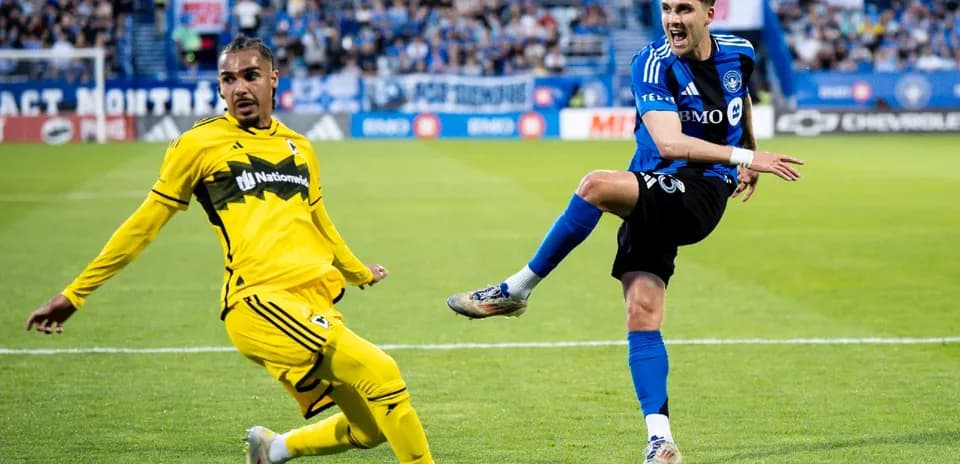 Player kicking the ball during MLS match