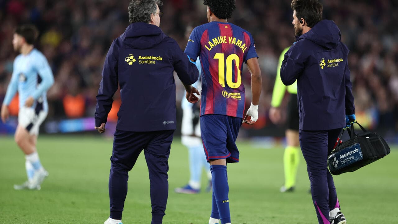 Player Lamine Yamal escorted by medical staff