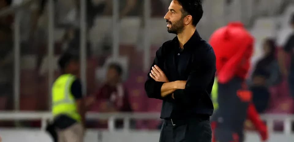 Coach observing the match from the sidelines