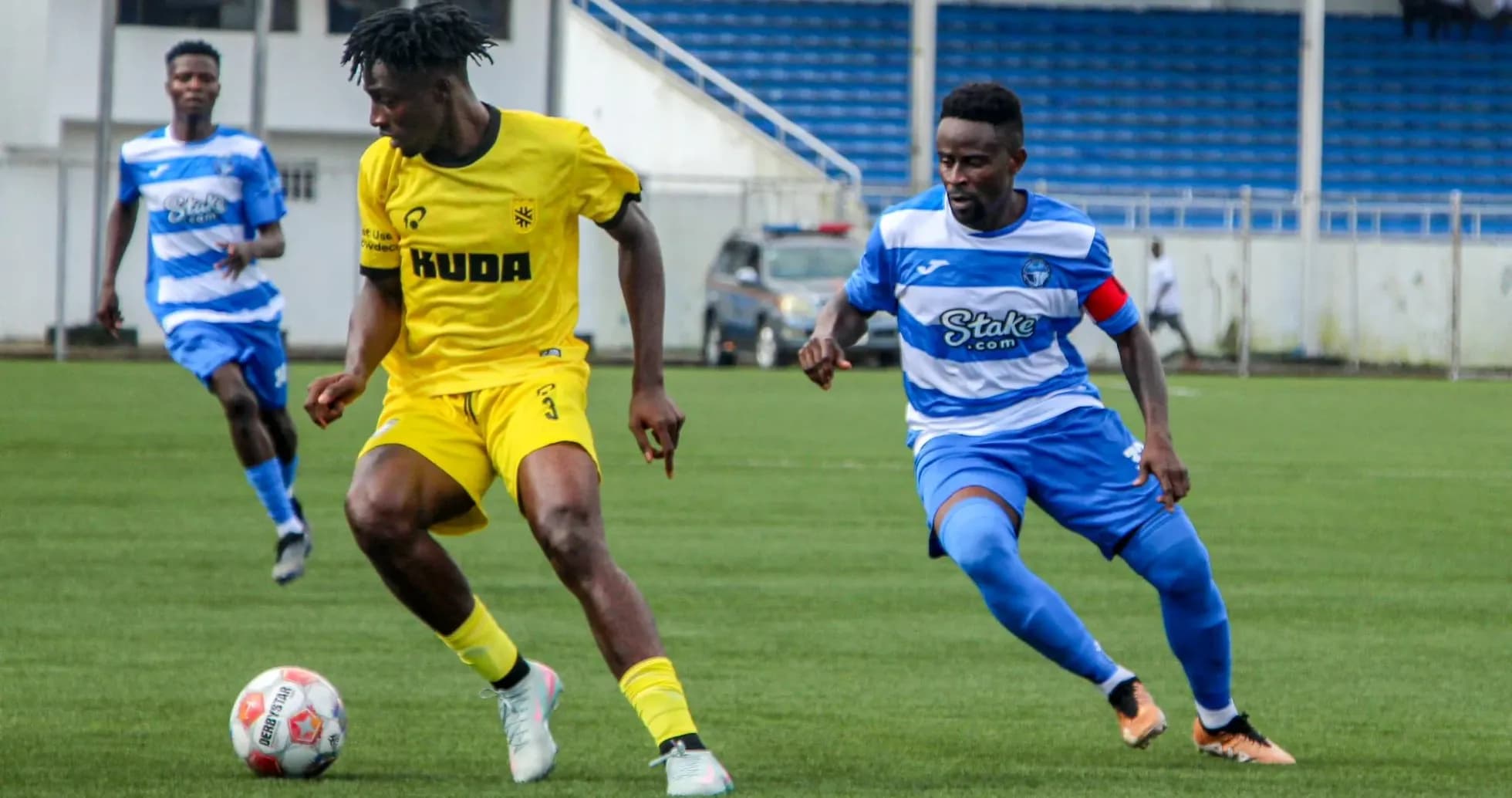 Players competing for the ball during match