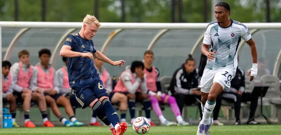 Player kicking ball during New England II match