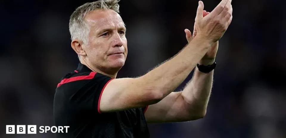 Manager applauding fans after match conclusion