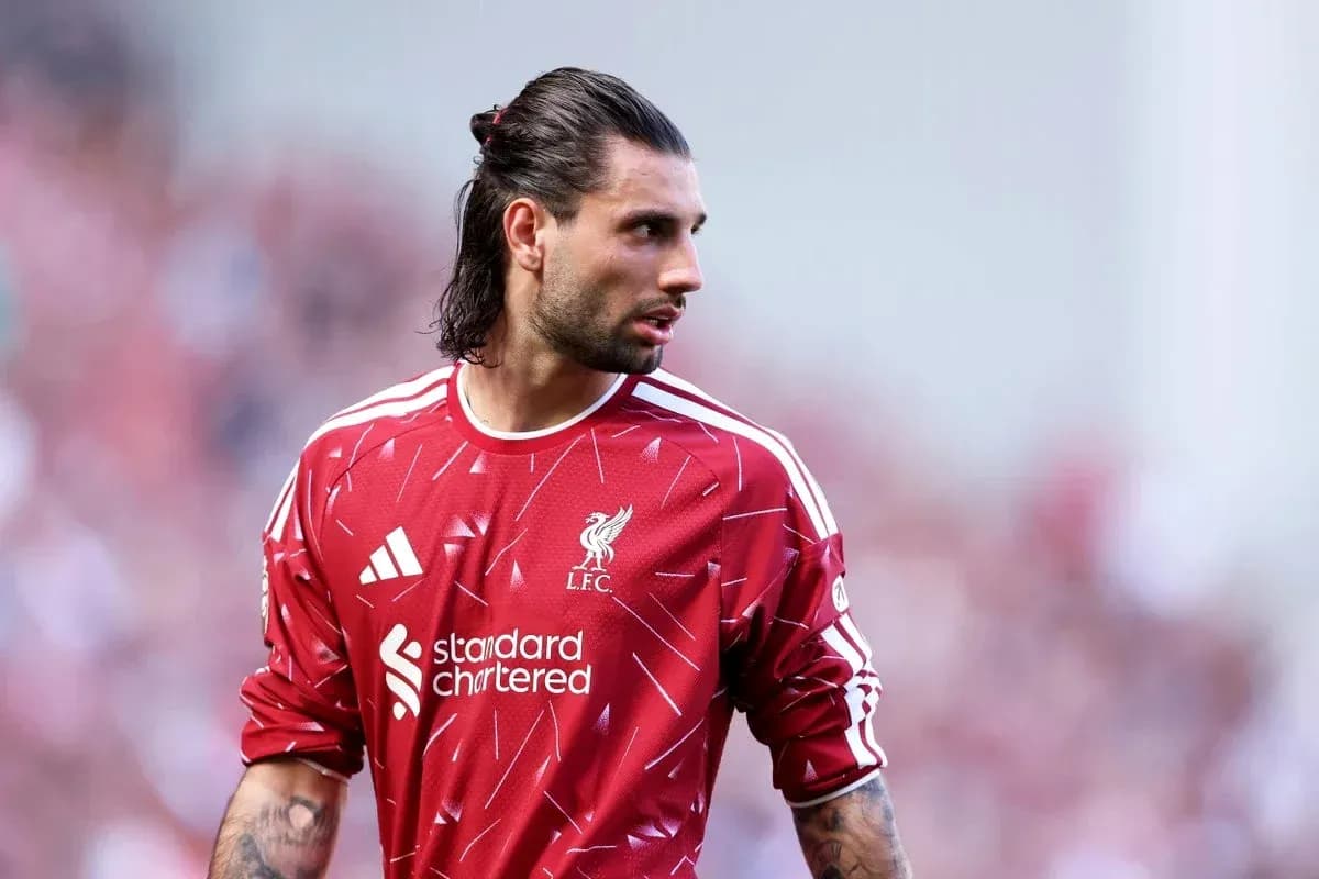 Goalkeeper in Liverpool kit during match warm-up