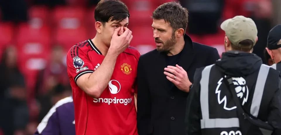 Player discussing with coach after match