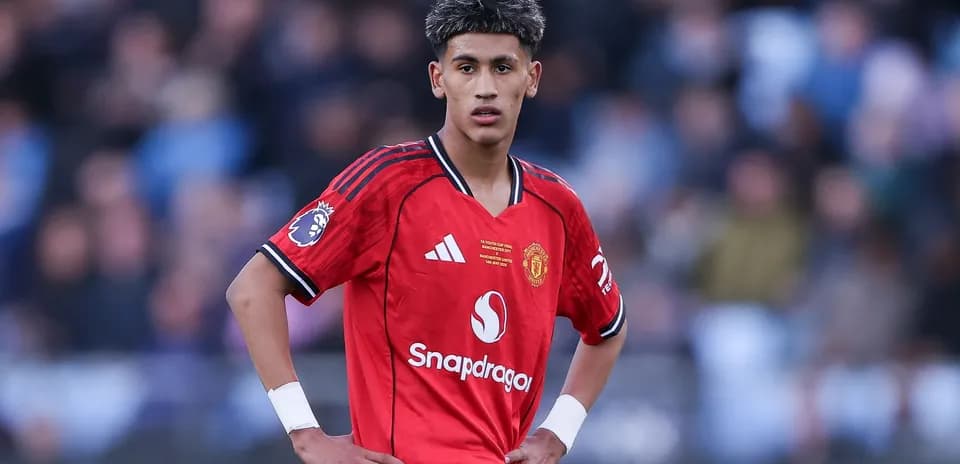 Player in red Manchester United kit on the field