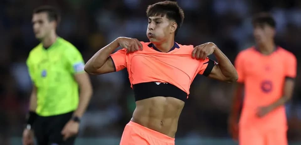 Player changing shirt during a match on field