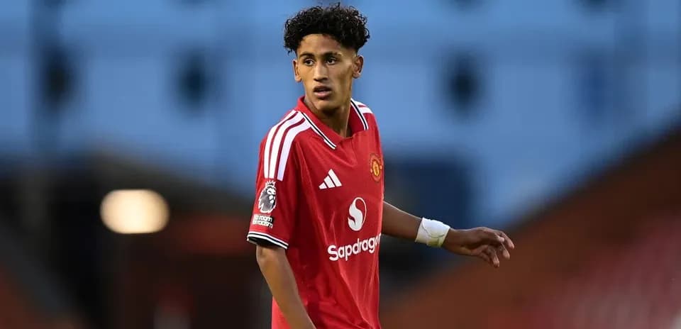 Young player in Manchester United kit on field