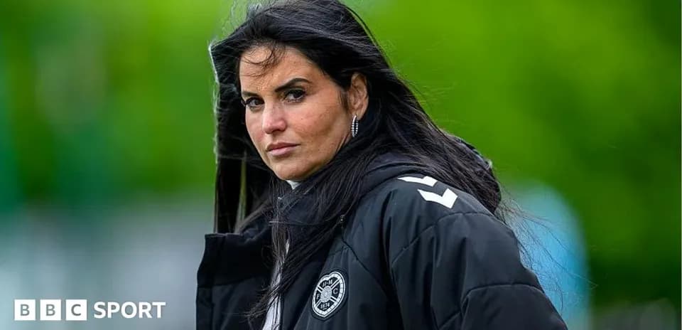 Female coach observing training session outdoors