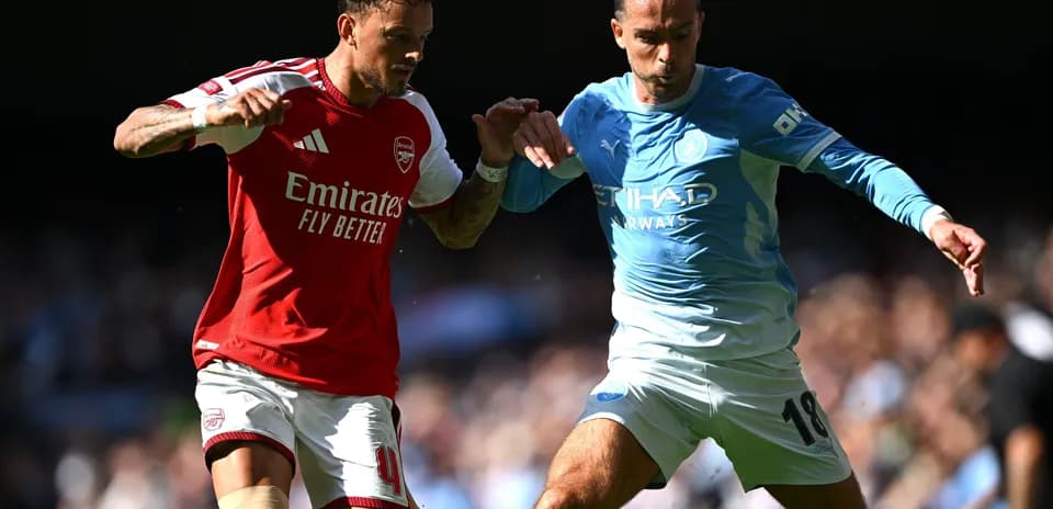 Two players contesting the ball during match