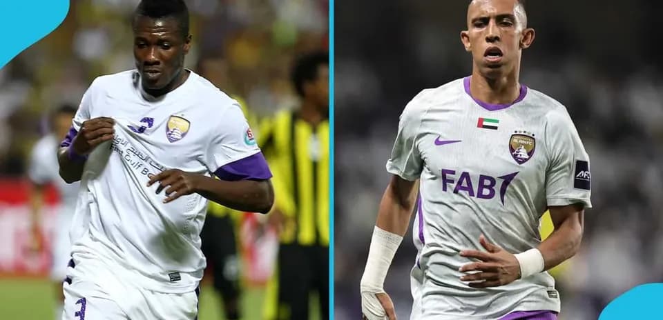 Two football players in Al Ain FC uniforms on pitch