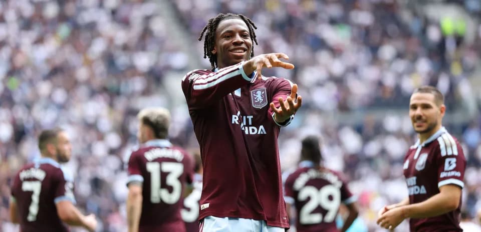 Aston Villa player celebrating on the pitch