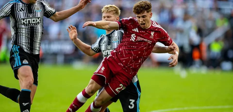 Newcastle and Liverpool players in action
