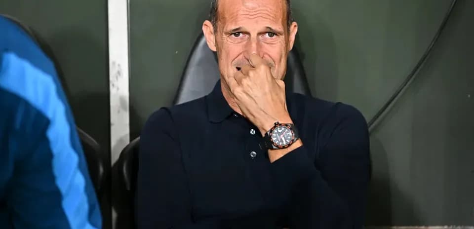 Coach sitting on bench during match