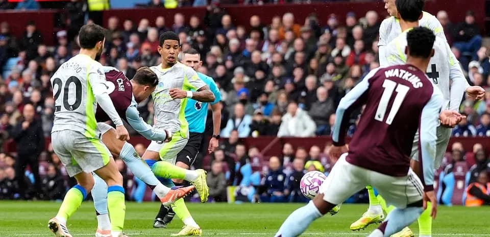 Manchester City player shooting against Aston Villa