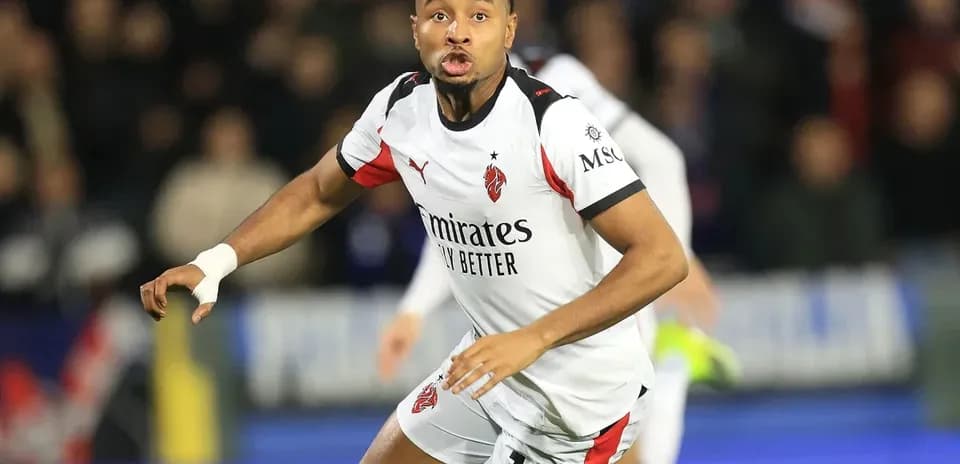 Player in white jersey running during match