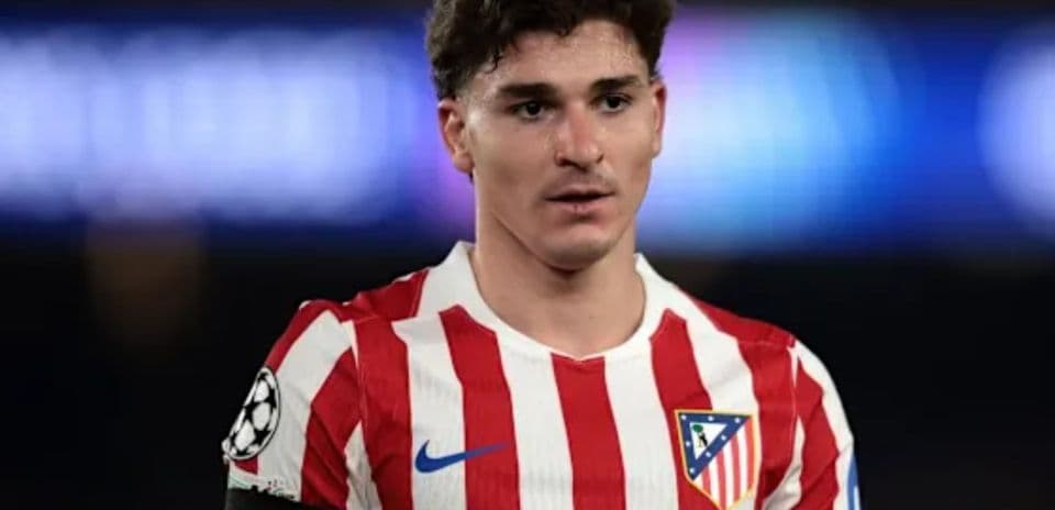 Atletico Madrid player in red and white jersey