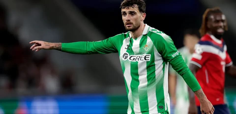 Player in green jersey gesturing during a match