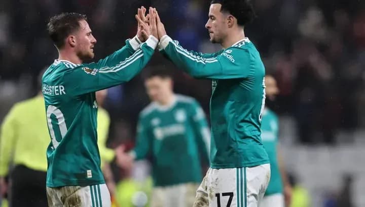 Two players celebrating during a football match