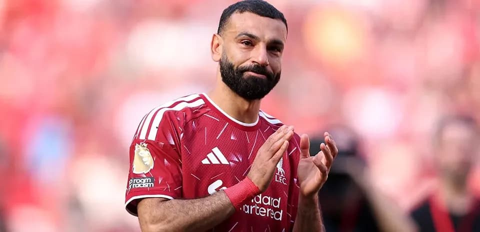 Player applauding fans after match at stadium