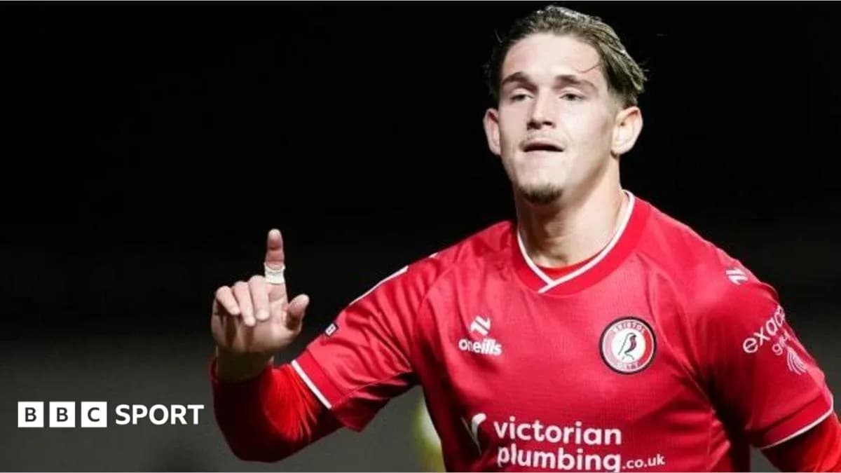 Player celebrating a goal in red team jersey