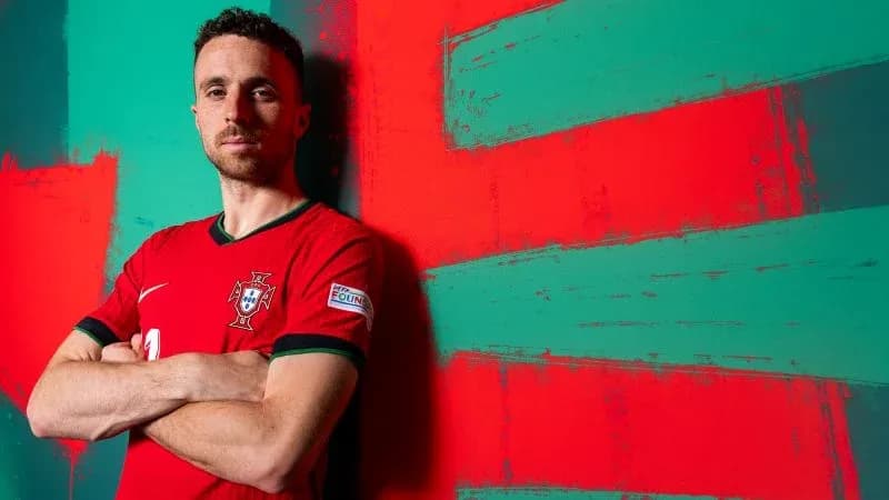 Player posing in Portugal national team jersey