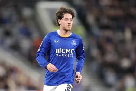 Player in blue jersey running on the pitch