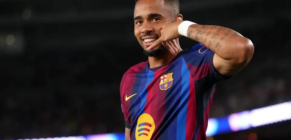 Player celebrating with a phone gesture on field