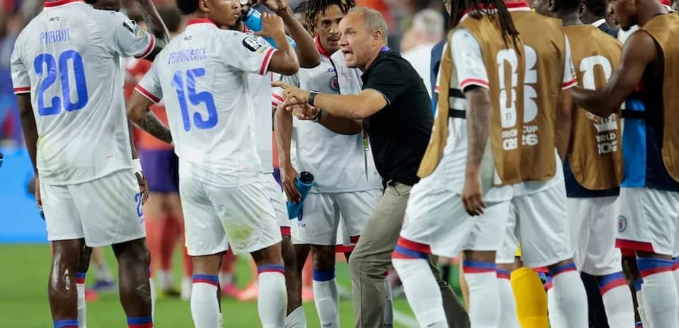 Haiti players drinking water during a match