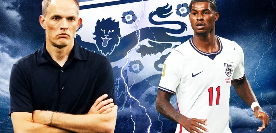Coach and player in front of England football emblem