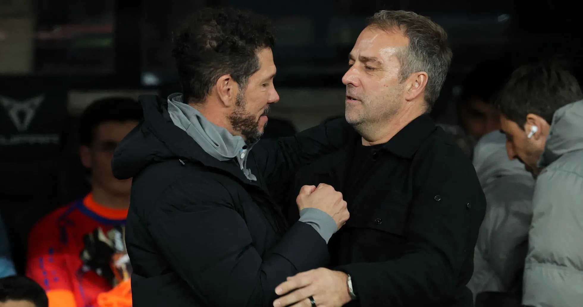 Coaches greeting each other before the match